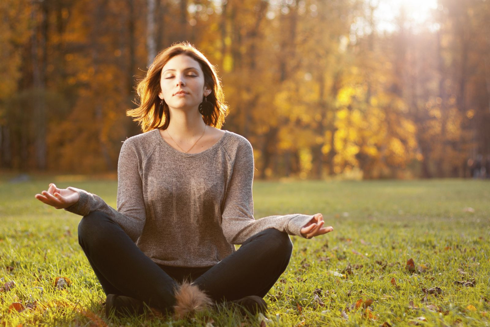 Person practicing mindful breathing and present moment awareness